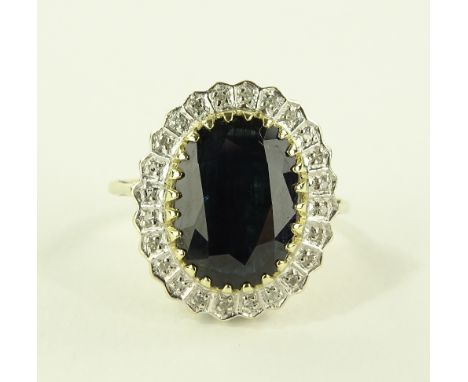 A large 9ct gold sapphire and diamond set panel ring, central sapphire approx. 5.8cts, setting height 19mm, size H.