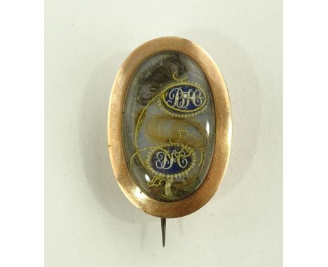 A Georgian unmarked gold memorial brooch, seed pearl enamel and hair panel, panel height 29mm.