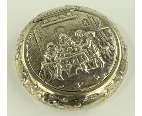 Continental circular silver snuff box, relief decorated lid with Tavern interior scene, diameter 8cm.