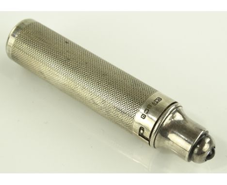A small engine turned silver pocket torch, makers marks C & C, Birmingham 1940, length 7.5cm.