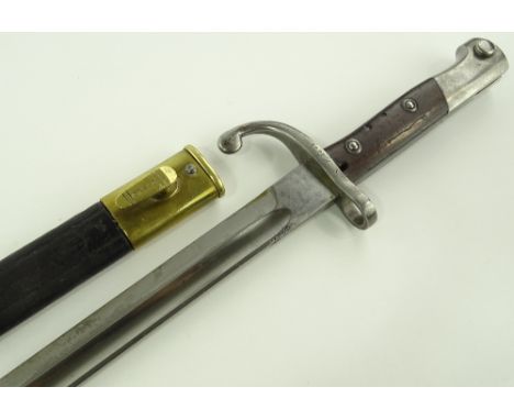 An early 20th century sword bayonet, brass mounted leather scabbard, blade length 30cm.