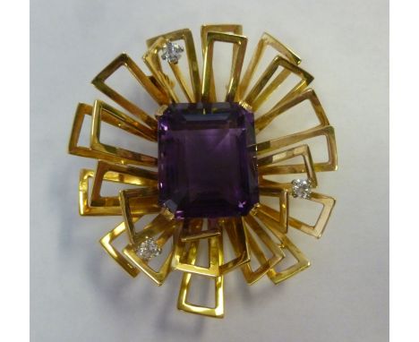 An 18ct gold brooch with angular 'petals', claw set with a central amethyst and three diamonds