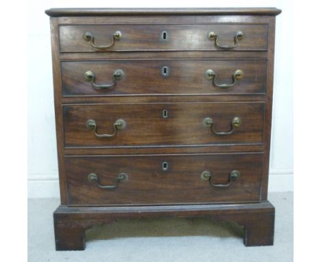 A George III mahogany chest, having four graduated long drawers with cock beading and brass swan neck handles, raised on brac