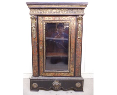 A mid 19thC boulle and ebonised pier cabinet with ormolu mounts, having an acanthus frieze, over a glazed panelled door, encl