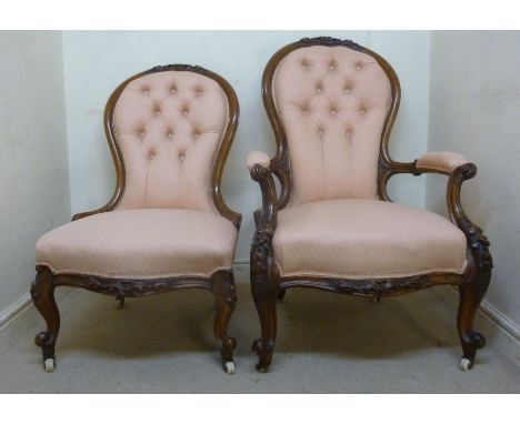 Late Victorian walnut showwood framed spoonback grandfather and grandmother chairs, each having a carved crest, part button u