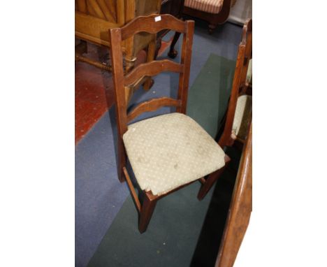 A set of eight ladder back chairs with rush seats.