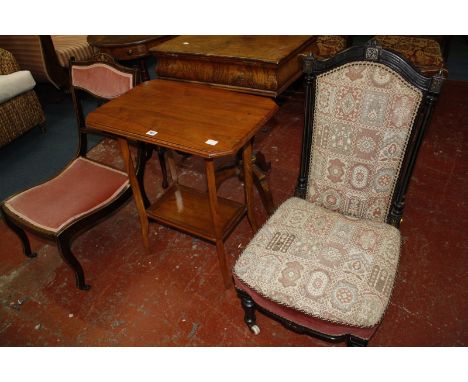 A Victorian ebonized nursing g chair, and Edwardian nursing chair, spindle back chair and a lamp table. Best Bid