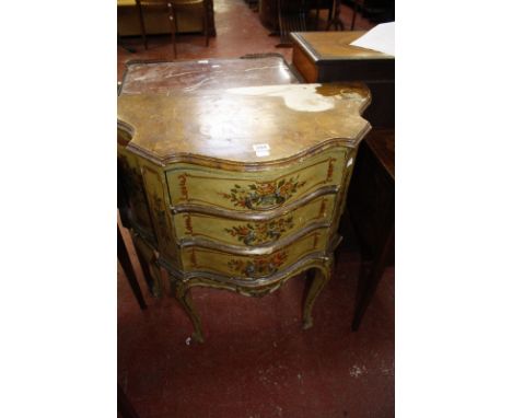An Italian painted commode chest of serpentine outline
