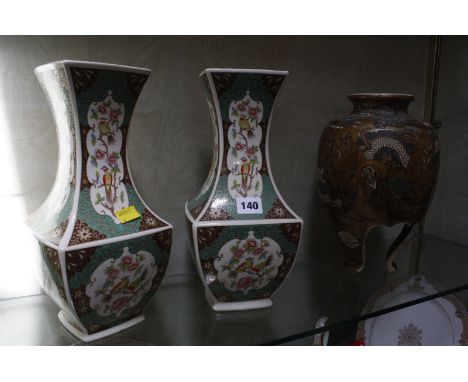 A pair of Japanese Satsuma vases on tripod shaped legs, decorated with wise men and dragon 30cm high (AF) and a pair of moder