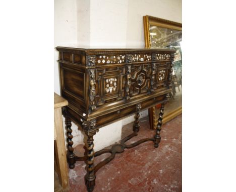 A Continental oak buffet with mother of pearl inlay, lion mask detail, raised on spiral supports.101cm wide x 122cm high.