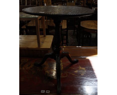 A George II oak tripod table,with a later foliate carved top, a Victorian mahogany and ebonised swing frame mirror 83cm high,