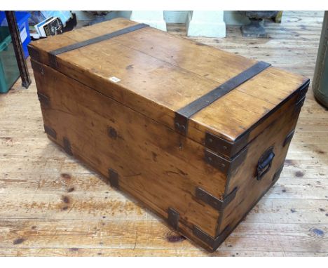 Pine and iron bound trunk, 45cm by 87cm by 47cm.