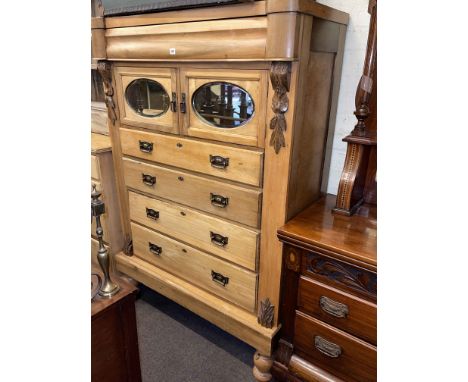Late Victorian stripped scotch chest having five drawers and two mirror panelled cupboard doors, 173cm by 118cm by 53cm.