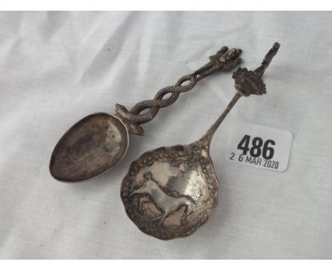 Indian silver caddy spoon with deity and a Dutch caddy spoon with  embossed bowl     