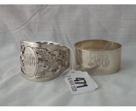 Napkin ring pierced and embossed with thistle motives – Sheff 1913  and another – 1943 - 58gms        