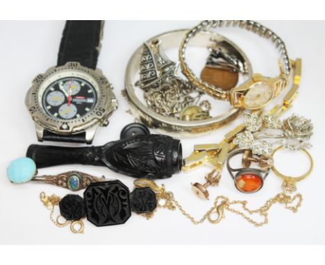 A mixed lot comprising a bangle marked '925', a Donnay wristwatch, an Irish carved bog oak cheroot holder, various jewellery.