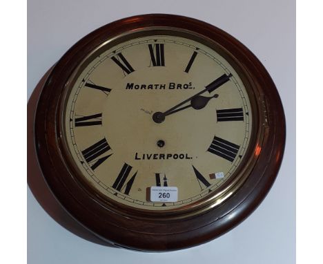 A spring driven wall clock by Morath Bros, Liverpool, the enamel dial set with roman numerals, diameter 39cm. The clock comes