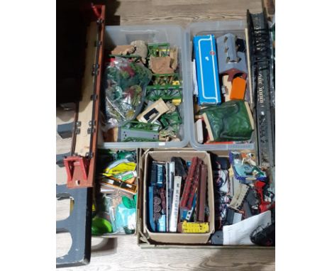 Four boxes of model railway accessories. 