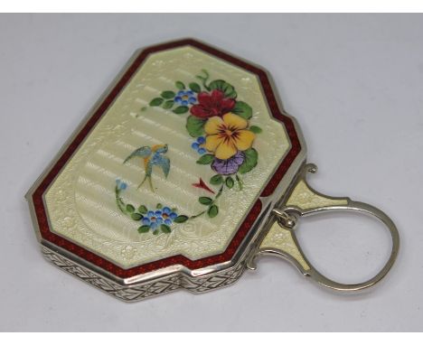 A vintage enamel and silver plated compact, length 8.5cm.Condition:- General wear through age and use, no sign of any major d