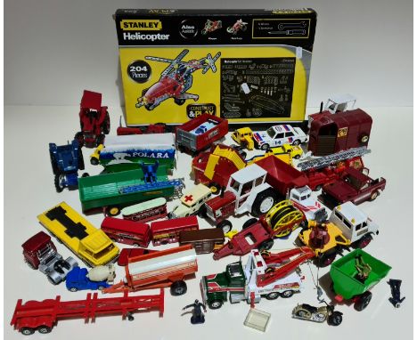 A box containing die-cast model vehicles including matchbox and Britains farm vehicles and a Stanley helicopter. 