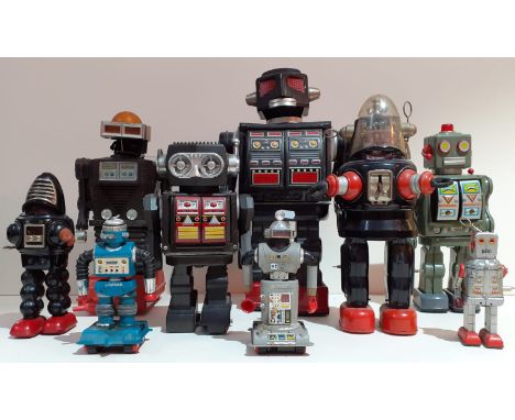 A collection of vintage robot toys, some boxed.