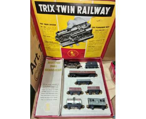 A Trix Twin TTR, HO scale, boxed model train with rolling stock and some track. 