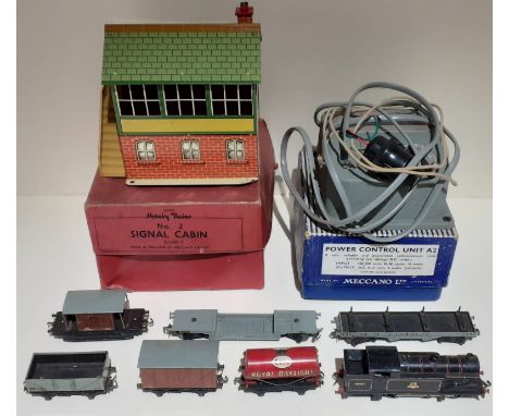 A box containing Hornby/ Meccano model railway items including power control unit, signal cabin, 69567 British Railways loco 