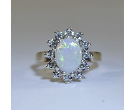 Ladies 9ct Gold Set Opal and Diamond Cluster Ring. The Central Opal Surrounded by 16 Small Diamonds. Fully Hallmarked - Pleas