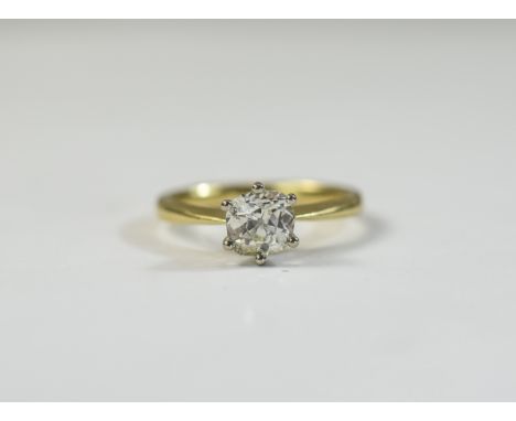 Ladies 18ct gold single stone diamond ring; Cushion cut diamond, approximately 1 ct. Small inclusions, commercial white stone