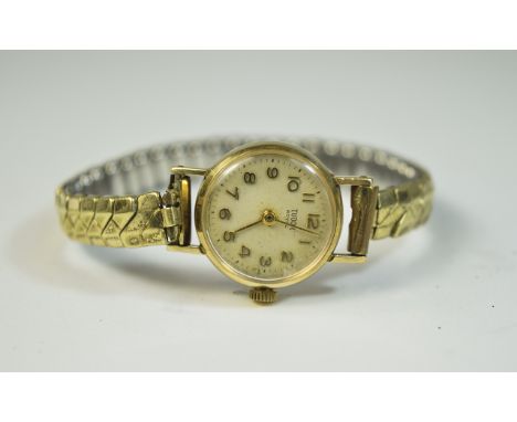 Ladies Rolex Tudor Royal 9ct Gold Ladies Cocktail Watch. Silvered dial with gold hands and numerals. Inside case hallmarked 9