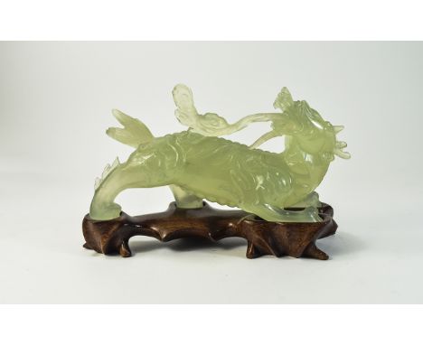 Chinese Jade Figure of a Mythical Dragon, Raised on a Wooden Shaped Stand. Early Part of The 20th Century. Height 4.5 Inches,