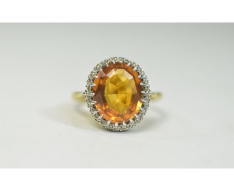 18ct Yellow Gold Set Topaz and Diamond Cluster Ring, The Central Faceted Topaz of Good Colour and Clarity - Over 5 cts. Surro