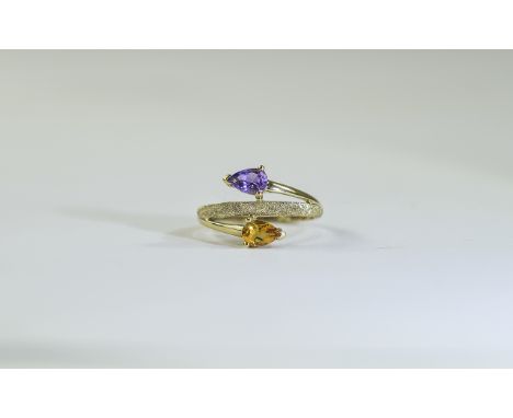 9 Carat Gold Dress Ring set with 2 round pear shaped gemstones and textured gold design., Fully hallmarked. Ring size M.