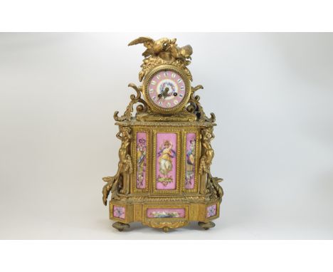 19thC  French Late Empire Clock. Decorative mantle clock with gilt ormolu decoration. Dusky pink porcelain dial with floral d