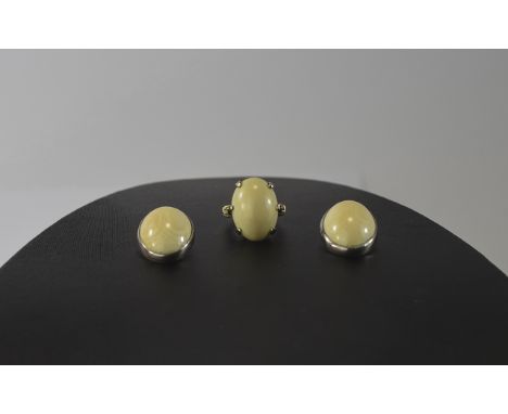 Ivory and Gold Ring plus Pair of Ivory Earrings, all three pieces featuring oval ivory cabochons; the ring set in gold with a