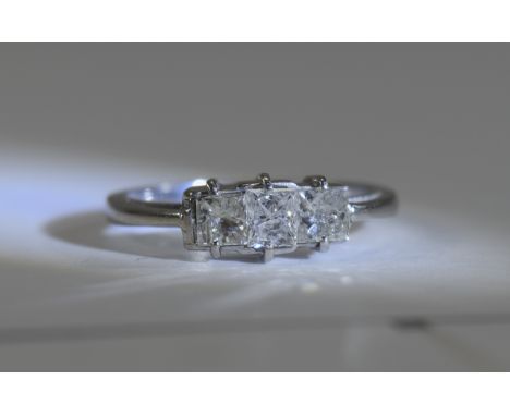 14ct White Gold Set 3 Stone Diamond Ring. The Princes Cut Diamonds of Good Colour. Marked 14ct. Est Diamond Weight 75 - 85 pt