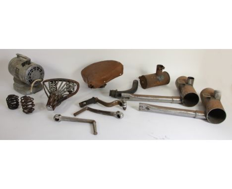 Two vintage seat bases, vintage style exhaust parts and other vintage parts, including brake components.