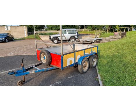A twin axle trailer, gross laden weight stated 2000KG, with ladder rack and metal sides/floor, lighting board 