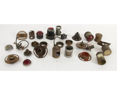 A collection of vintage rear lamp holders, bodies and lenses