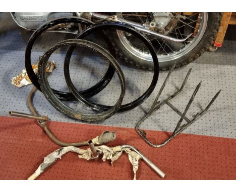 Three vintage belt drive rims, two handlebars and a luggage rack 
