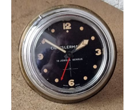 A Benrus Chryslermatic dash board mounted clock with bezel windingThe clock is ticking. 