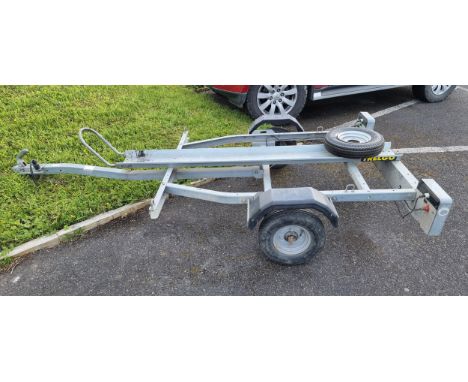 A Trelgo galvanised single axle single bike trailer, 350kg, with built in lighting and spare wheel 