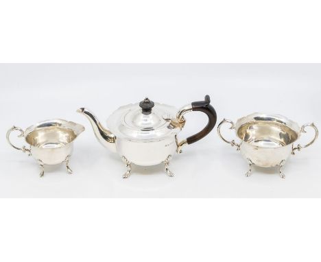 A late Victorian silver Bachelor three piece tea set, flared wavy rims above plain bodies on shell and trefid feet, the teapo