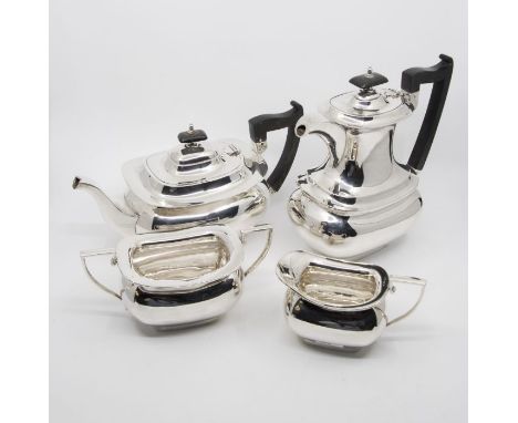 A Georgian style plain silver four piece tea and coffee service to include: teapot, coffee / hot water pot, milk jug and suga