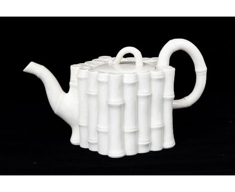 Irish Interest: A Belleek 1st period bamboo pattern large teapot, the body in the form of moulded bamboo stems, the cover wit
