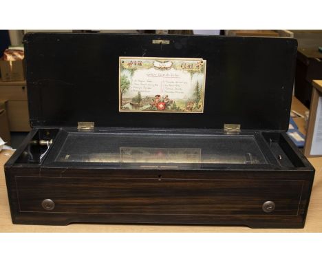 A late 19th Century Swiss table top cylinder musical box, strung and floral parquetry inlaid case, card song sheet to the inn