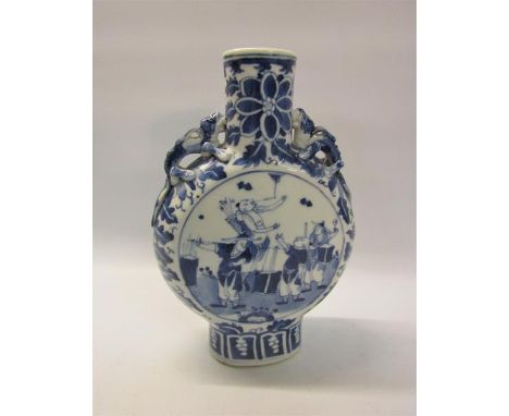 A 19c Chinese moon flask, blue on white decorated with panels of entertainers and moulded serpents to the shoulders.  20cms h