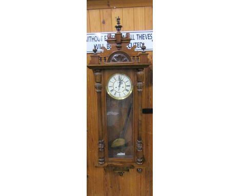 A late 19c German two weight Vienna Regulator by Gustav Becker.  The glazed walnut case has fluted columns flanking the door 