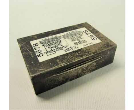 A silver table snuff box of rectangular form with gilt lined interior, the hinged cover applied with a railway ticket insert 