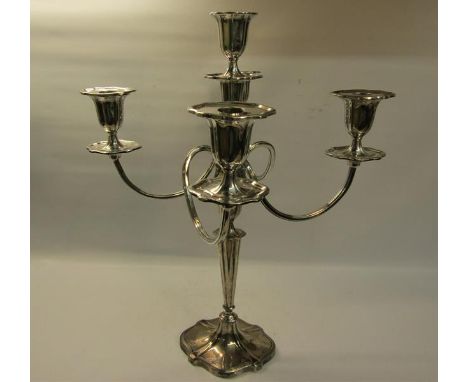 A silver four branch candelabra with central stick on a tapering column with shaped domed base, filled.  Makers mark for Walk